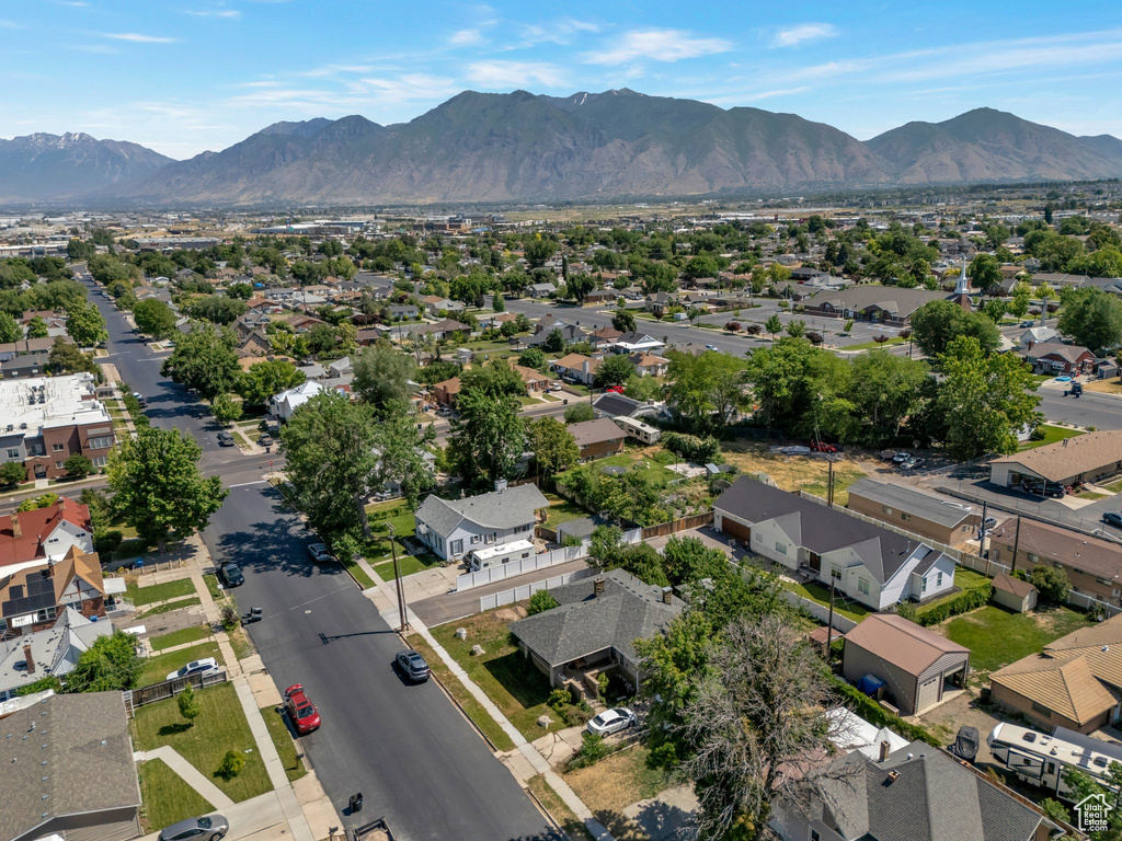 Aerial perspective of suburban area featuring a mountain backdrop
