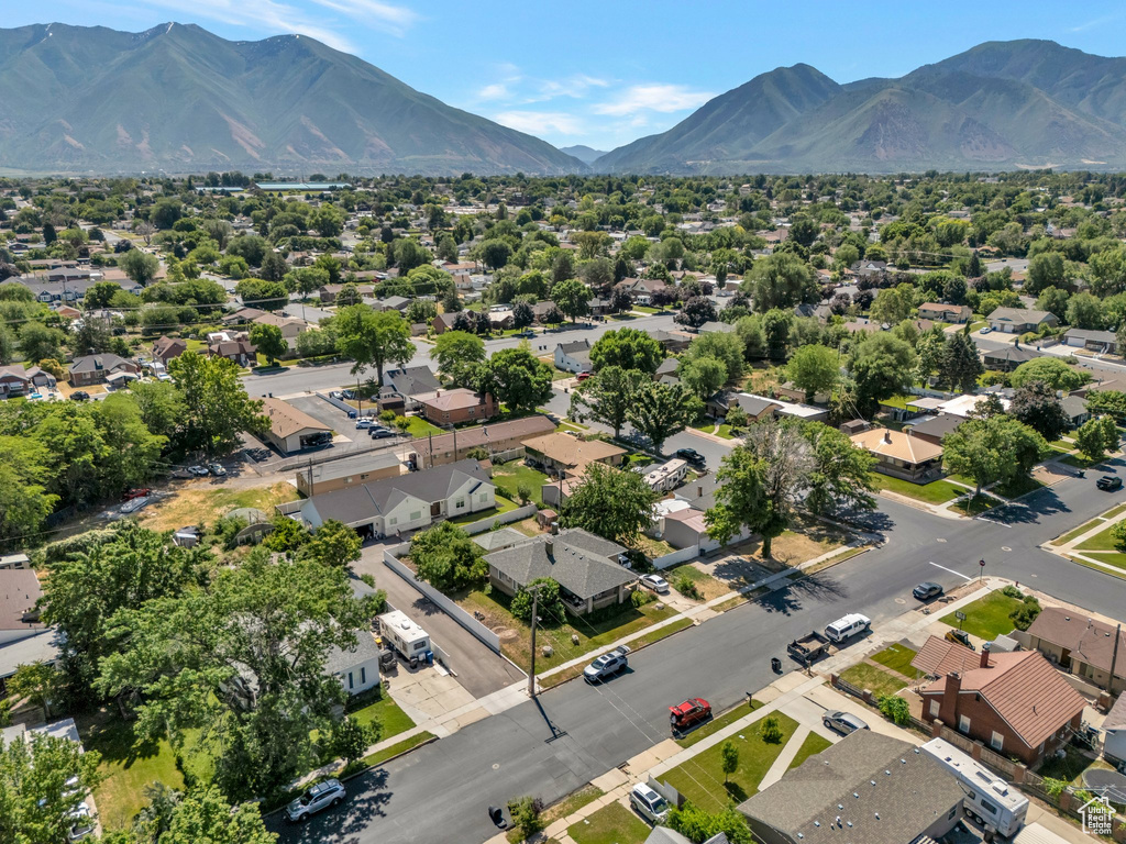 Aerial perspective of suburban area featuring a mountain backdrop