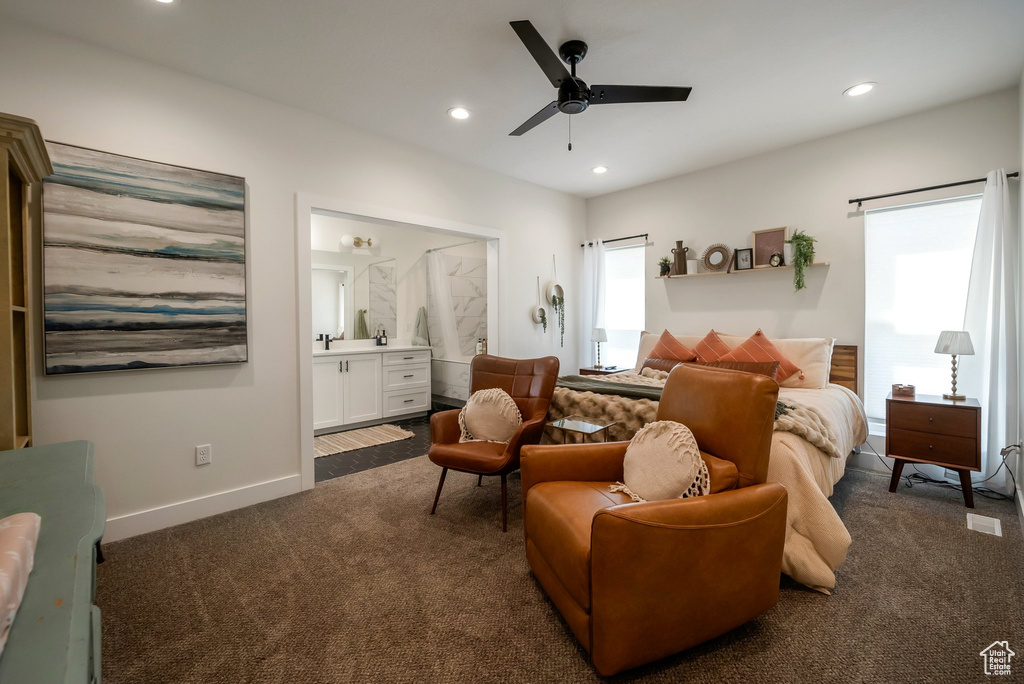Bedroom with dark colored carpet, recessed lighting, connected bathroom, and ceiling fan
