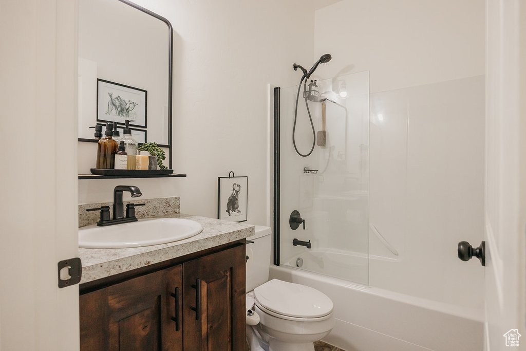 Bathroom with vanity and  shower combination