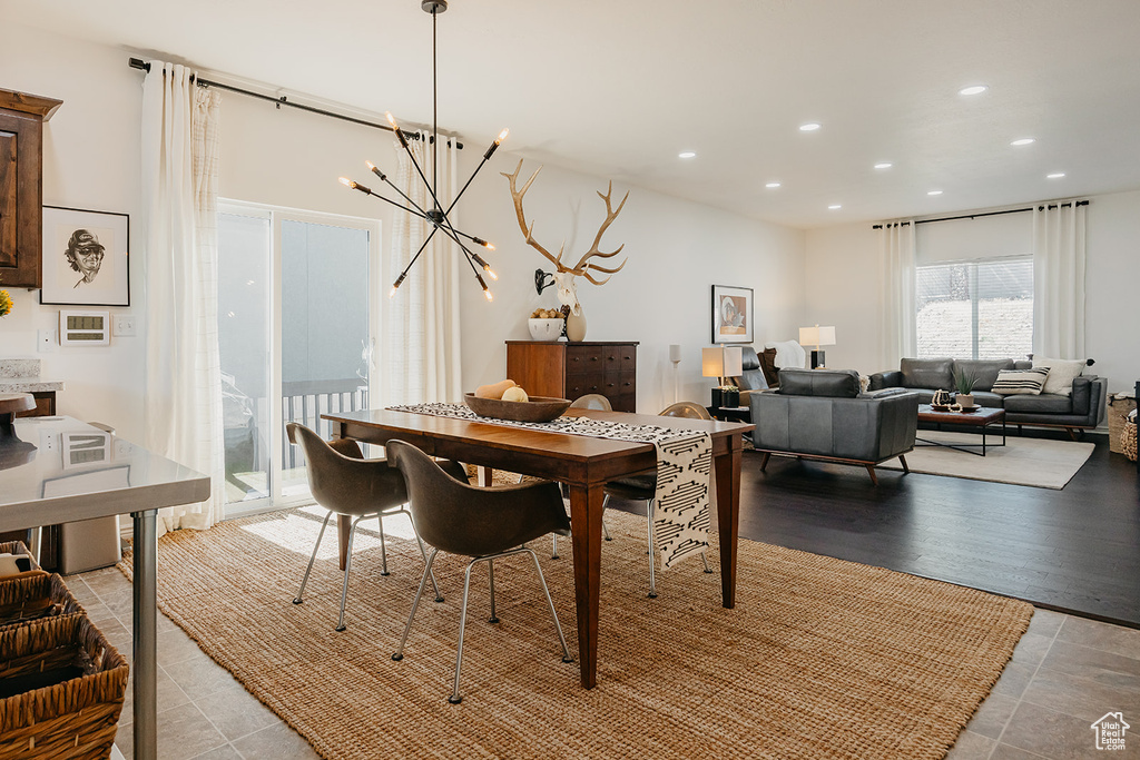 Dining area with recessed lighting and a chandelier