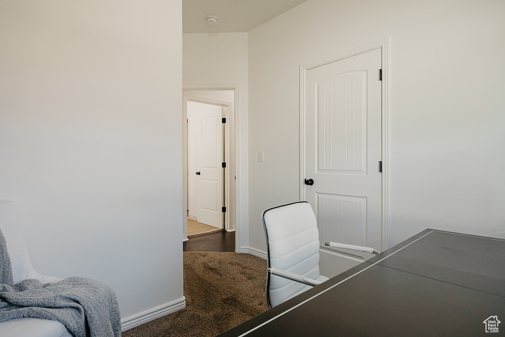 Bedroom with baseboards and carpet