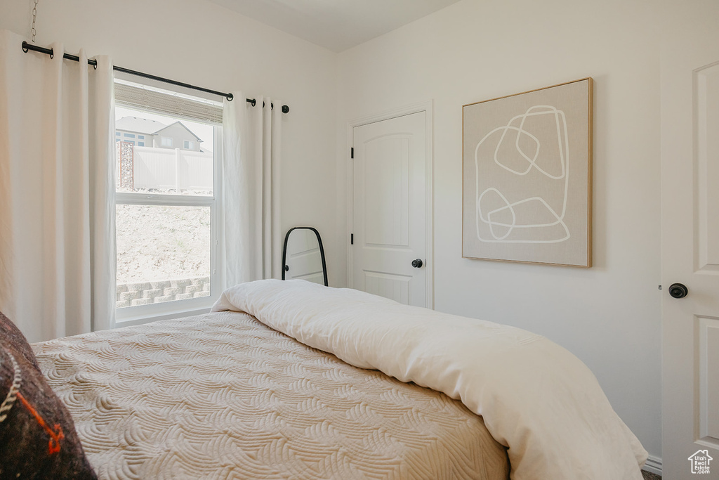 Bedroom featuring multiple windows