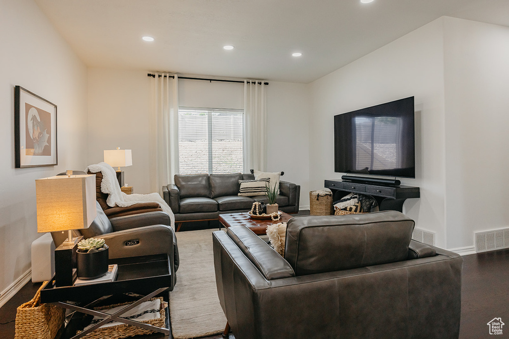 Living area with recessed lighting and wood finished floors