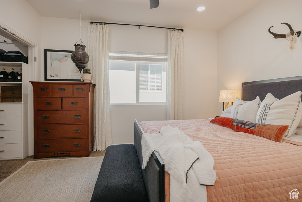 Bedroom with light colored carpet