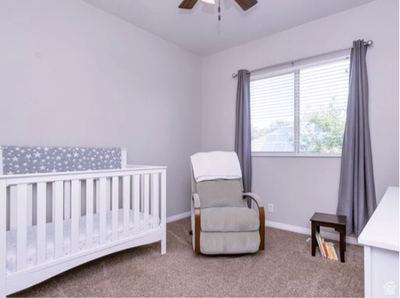 Bedroom featuring carpet and ceiling fan