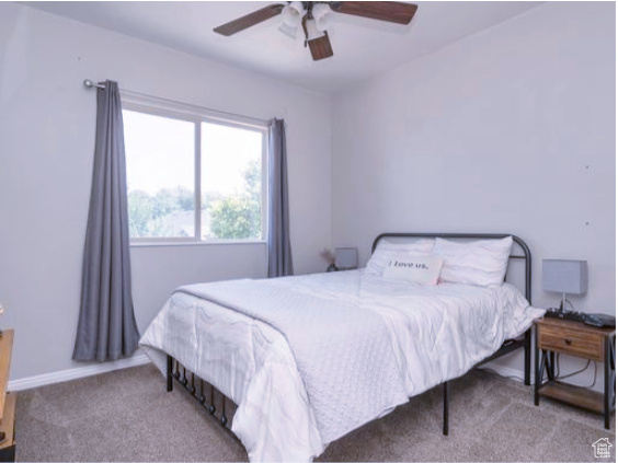 Bedroom featuring carpet flooring and a ceiling fan