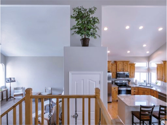 Kitchen featuring appliances with stainless steel finishes, recessed lighting, and a center island