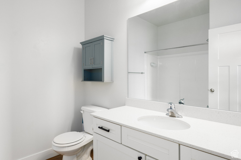 Bathroom featuring vanity and a shower