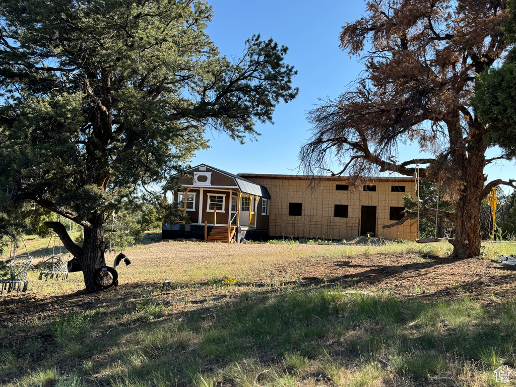 Back of property featuring entry steps