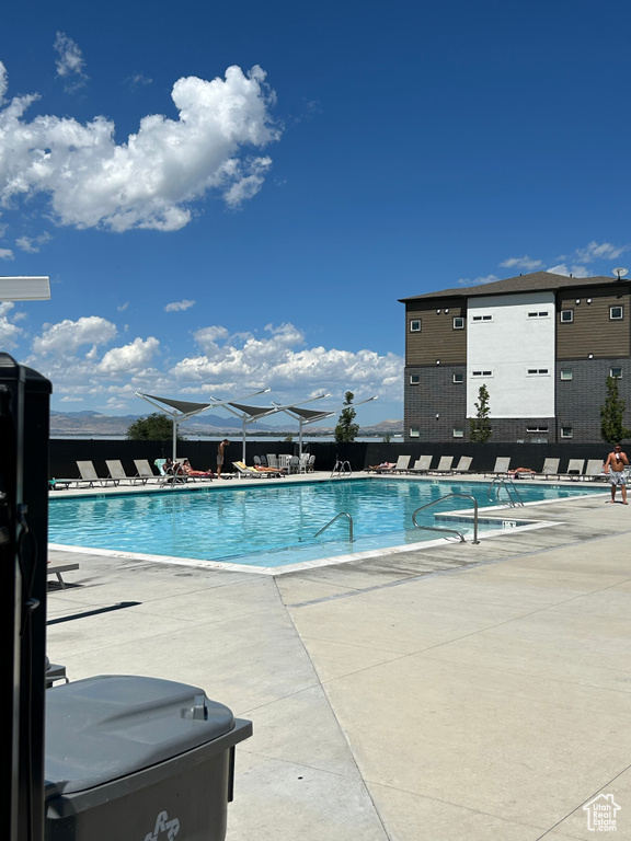 Community pool featuring a patio area