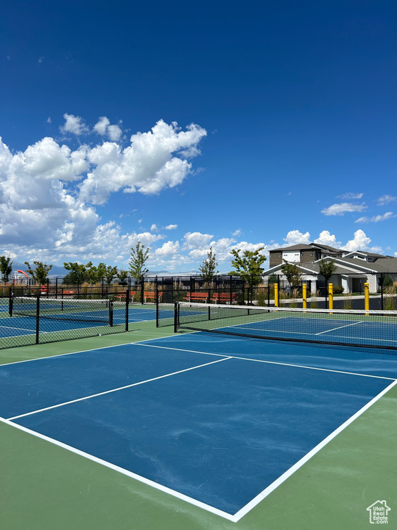 View of tennis court featuring community basketball court