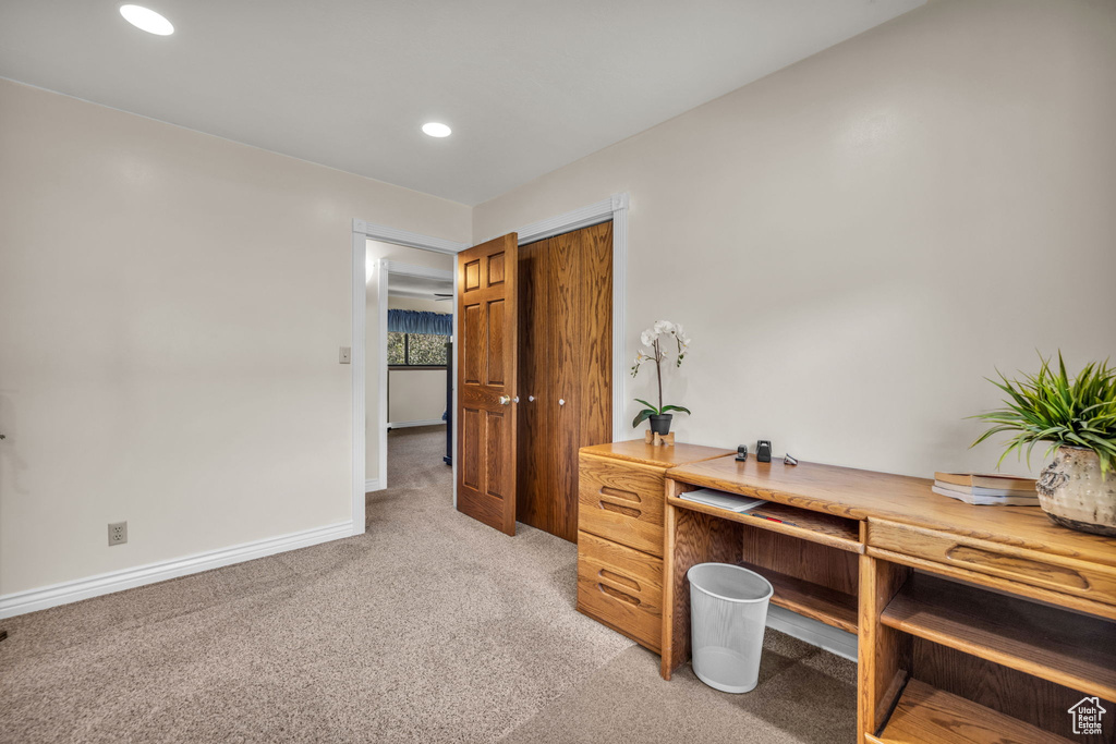 Home office with light carpet, baseboards, and recessed lighting