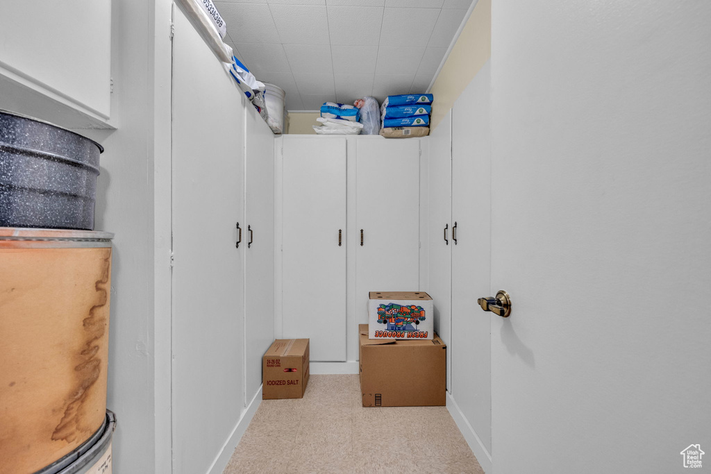 Spacious closet with carpet flooring