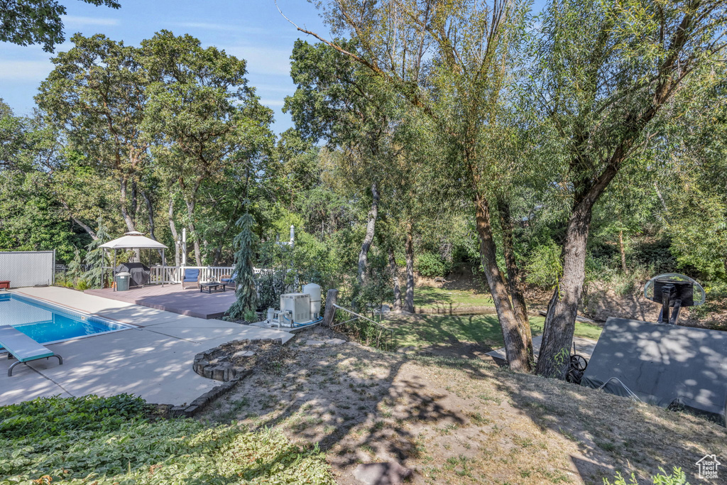 View of yard featuring a wooden deck
