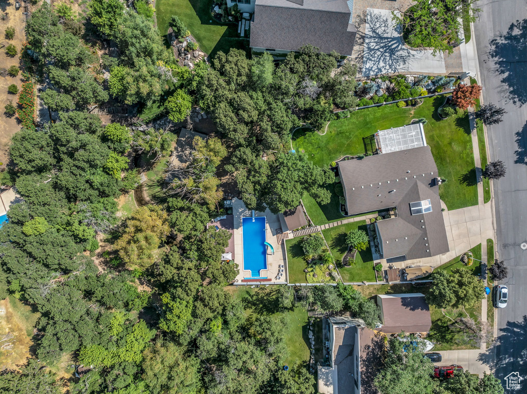 Aerial view of property and surrounding area with a pool
