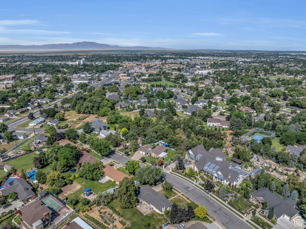 Aerial overview of property\'s location featuring mountains and nearby suburban area