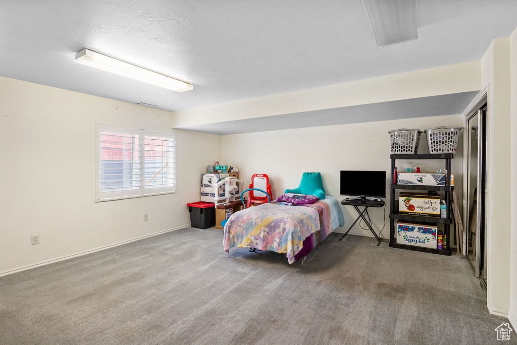 Carpeted bedroom with baseboards
