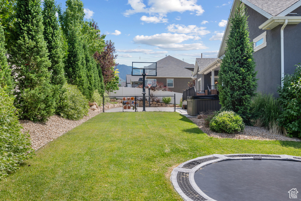 View of yard with a hot tub