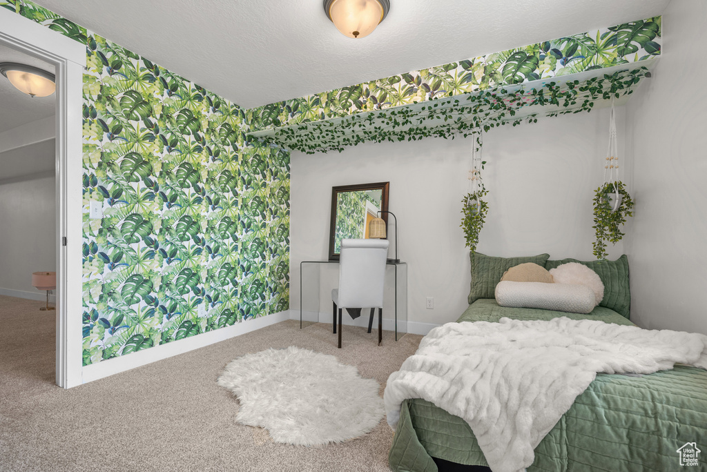 Carpeted bedroom with baseboards