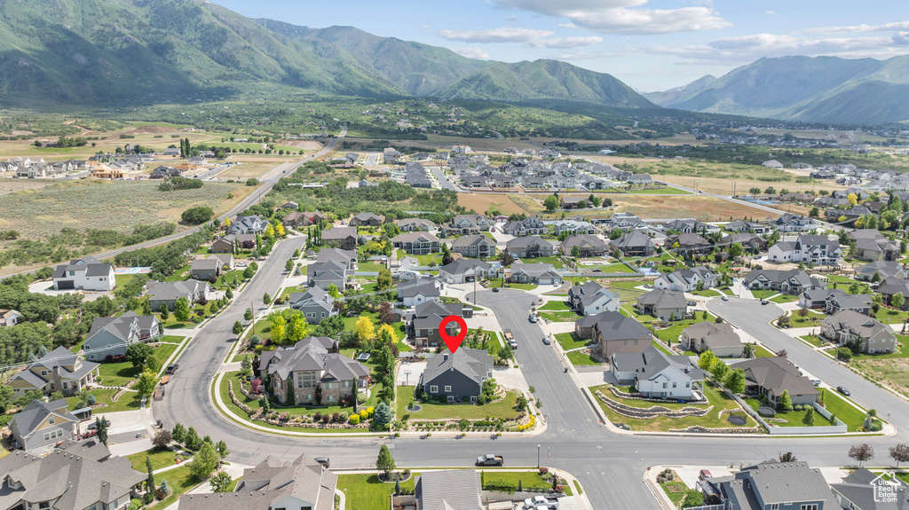 Aerial perspective of suburban area with a mountain backdrop