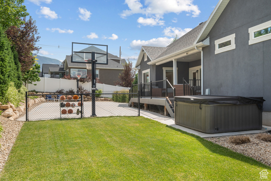 View of yard with a hot tub