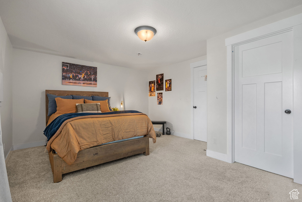 Carpeted bedroom with baseboards