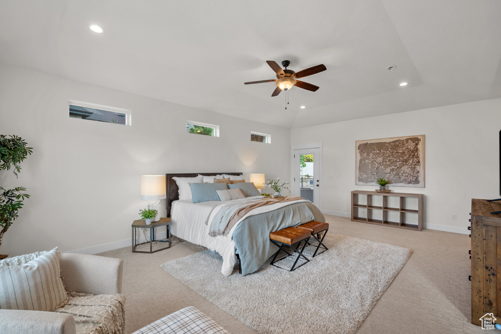 Bedroom with light colored carpet, recessed lighting, and a ceiling fan