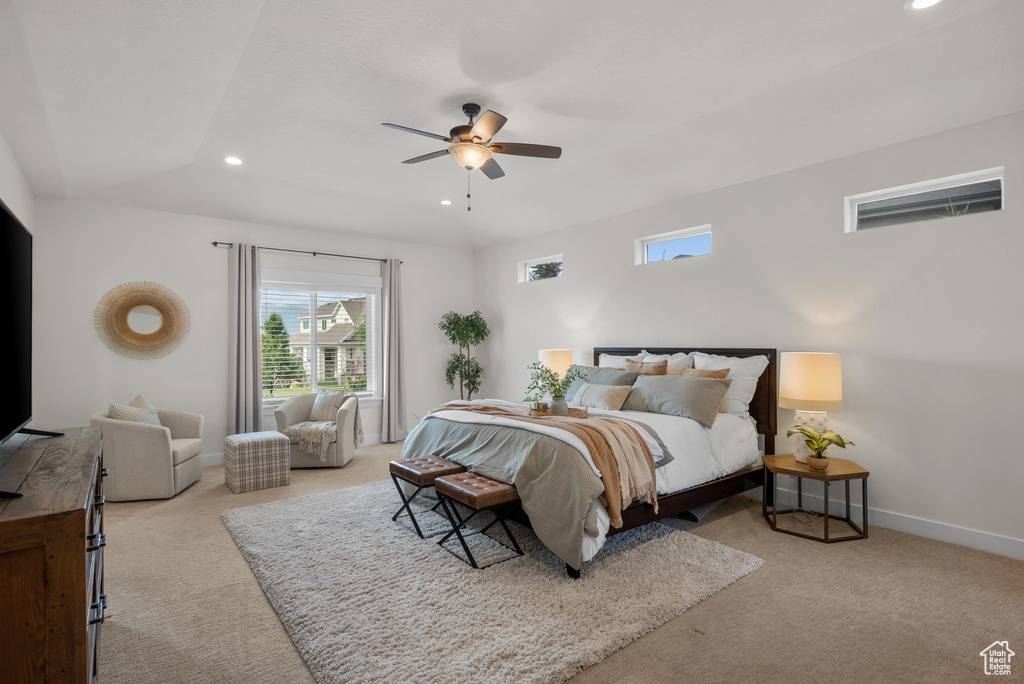Carpeted bedroom featuring recessed lighting and a ceiling fan