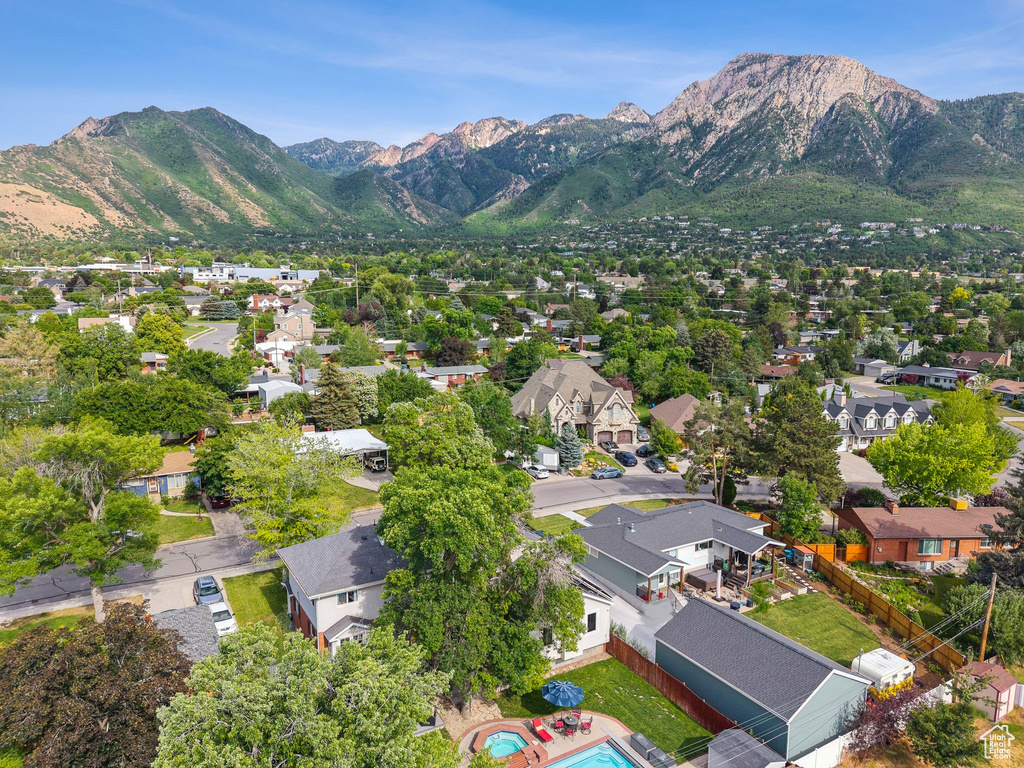 Aerial perspective of suburban area featuring a mountain backdrop