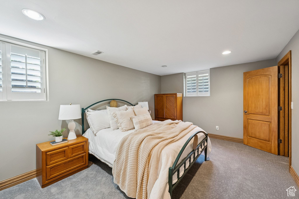 Bedroom featuring light carpet and recessed lighting