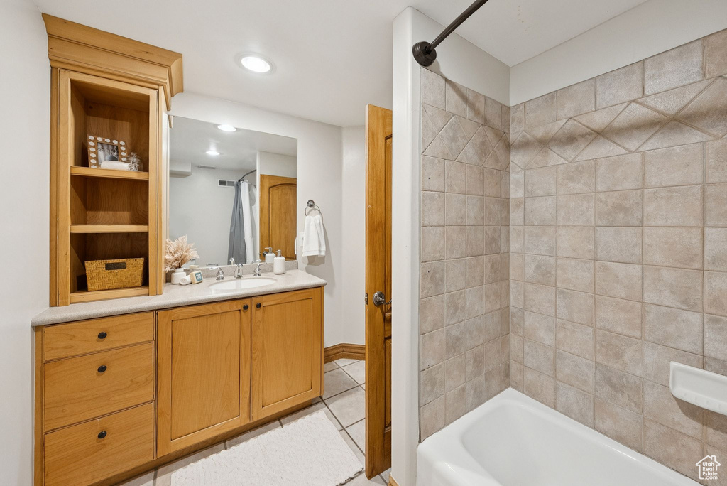 Full bathroom with tile patterned flooring, vanity, and bathtub / shower combination