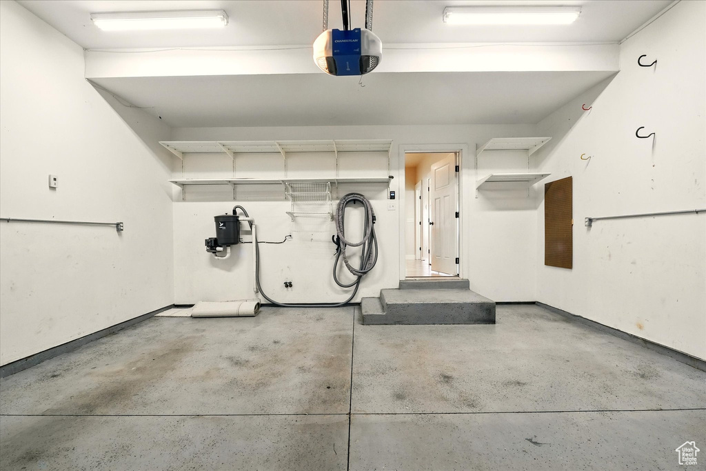 Garage featuring a garage door opener