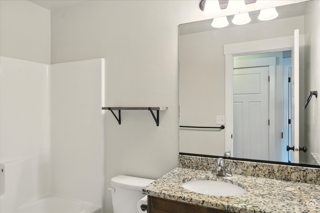 Full bath with vanity and shower / washtub combination