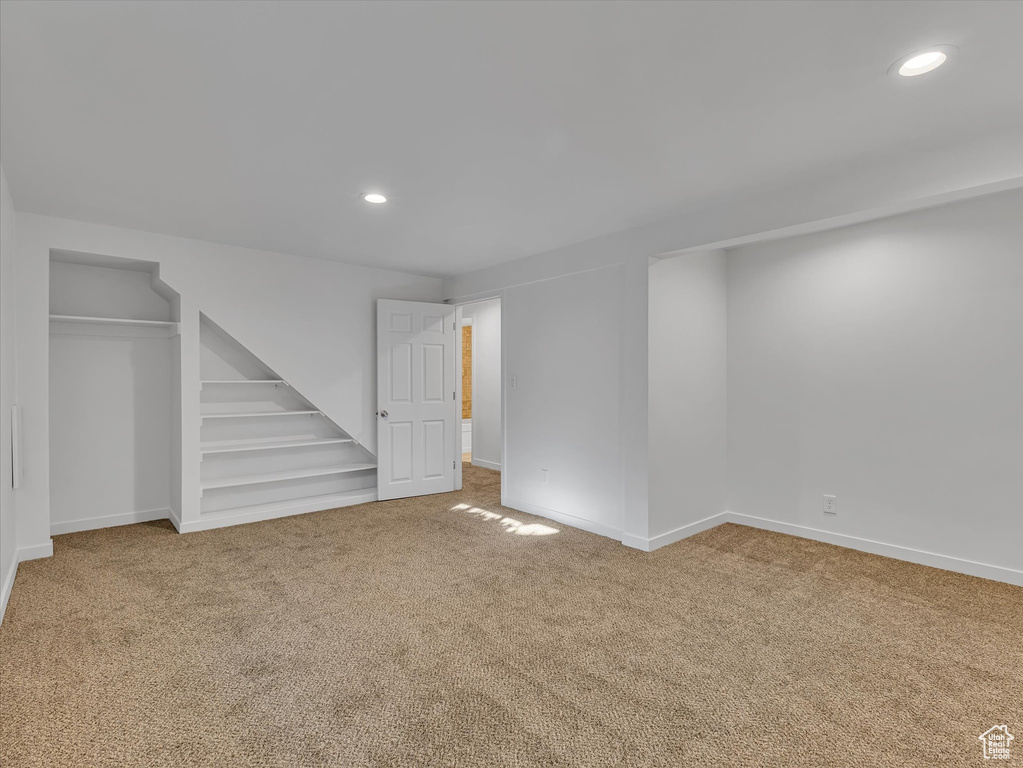 Below grade area featuring carpet flooring and recessed lighting