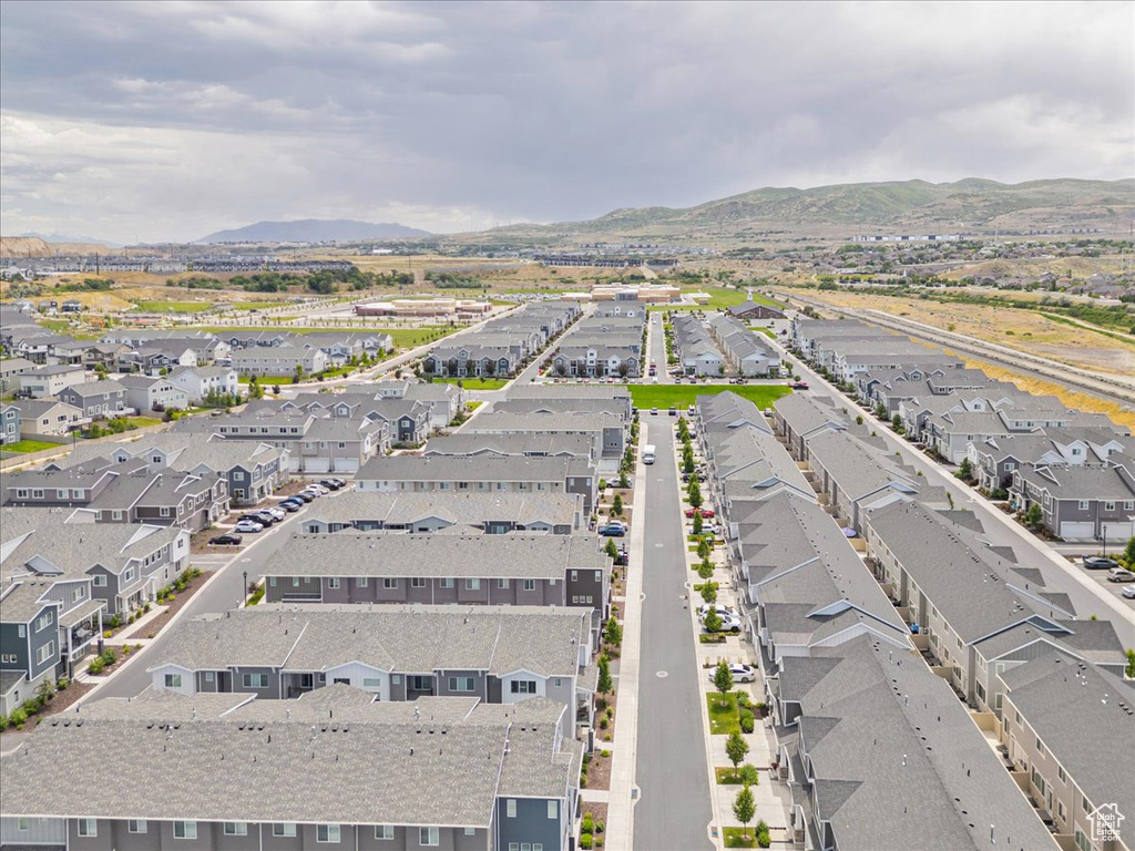 View of property location featuring a mountain backdrop and nearby suburban area