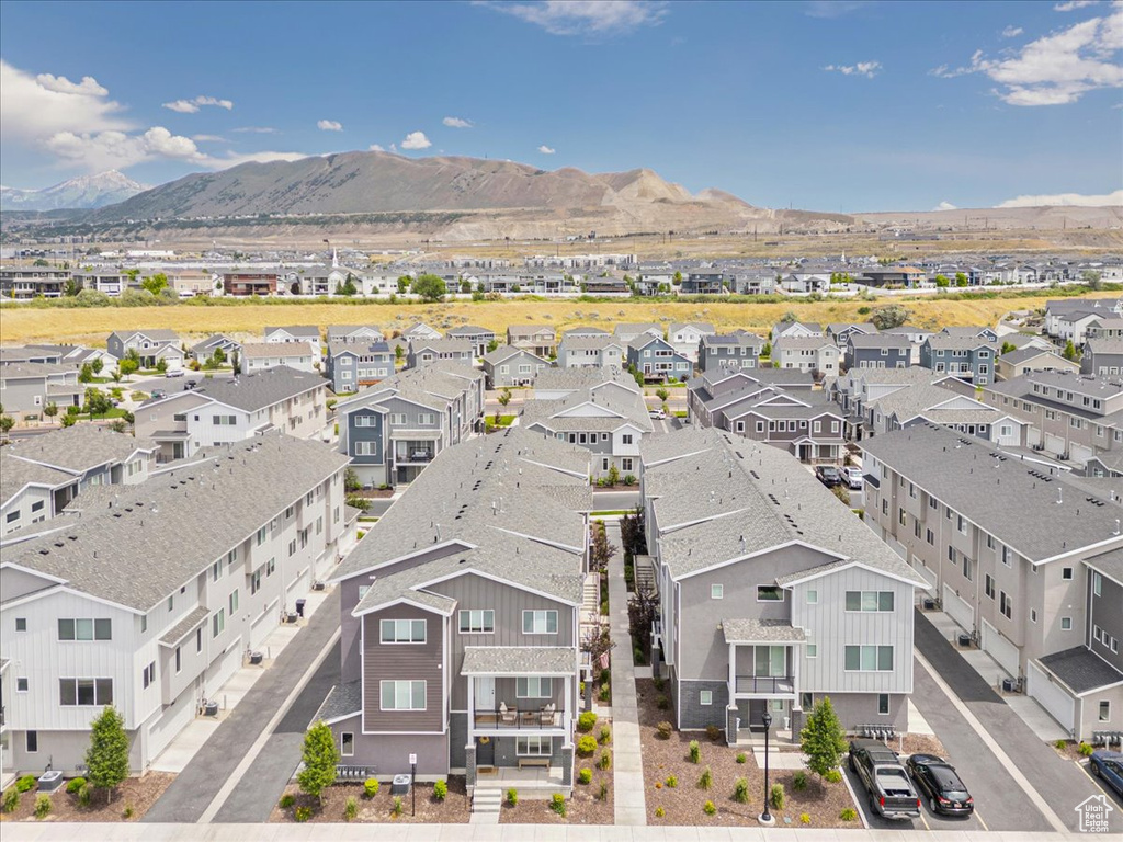 Aerial perspective of suburban area featuring a mountain backdrop