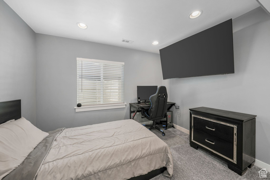 Bedroom with carpet floors, recessed lighting, and baseboards