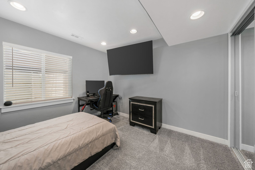 Bedroom with carpet, recessed lighting, and baseboards