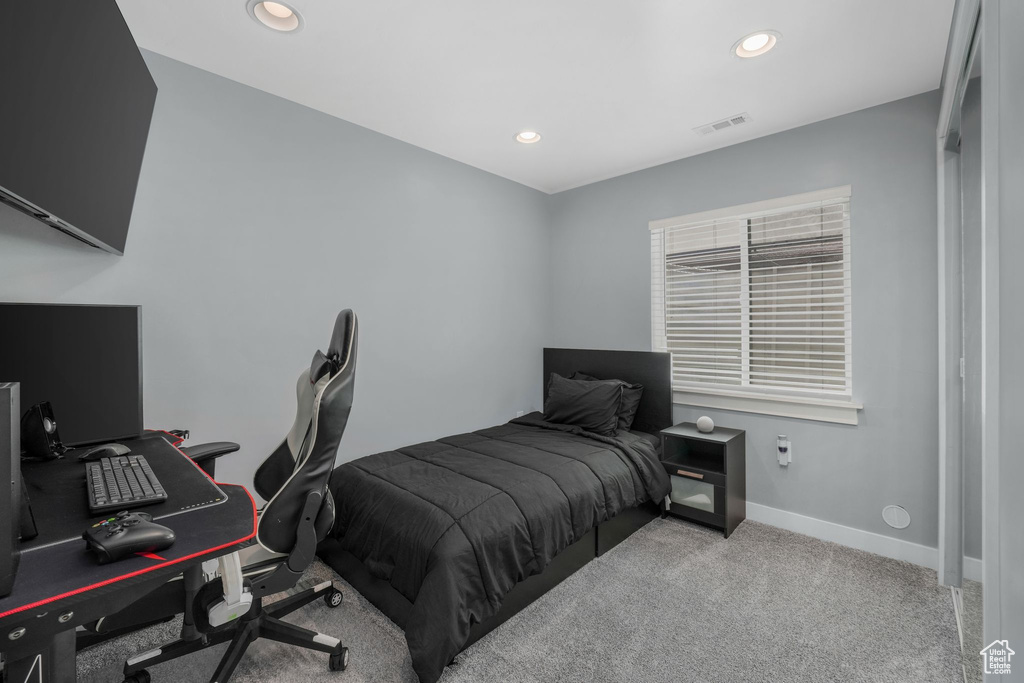 Carpeted bedroom with recessed lighting, a desk, and baseboards