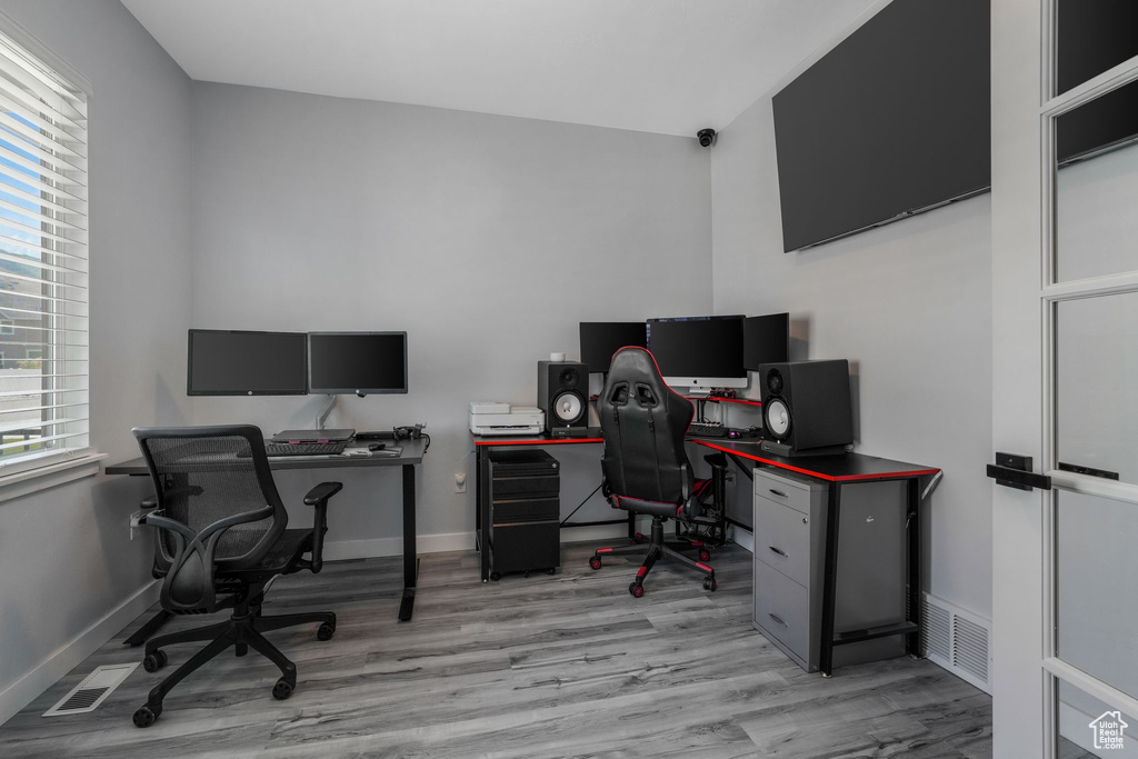 Office with light wood finished floors and baseboards