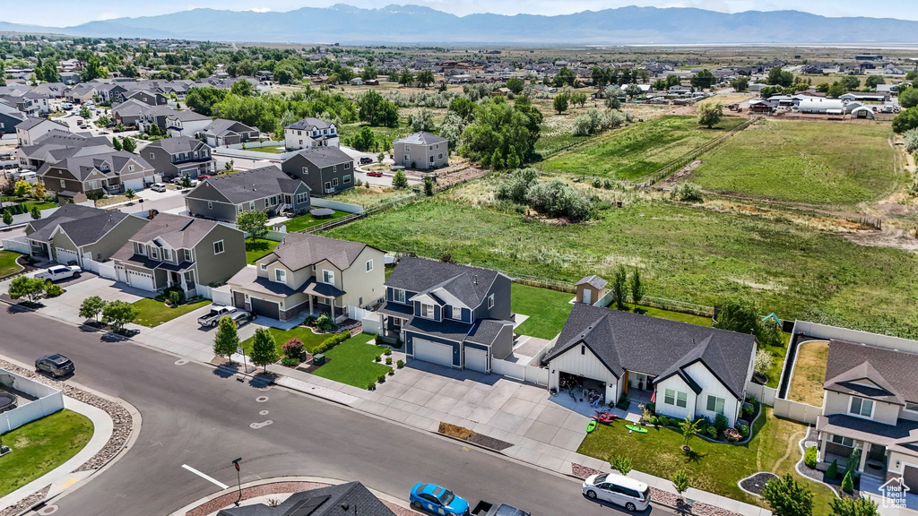 Aerial view of residential area featuring a mountainous background