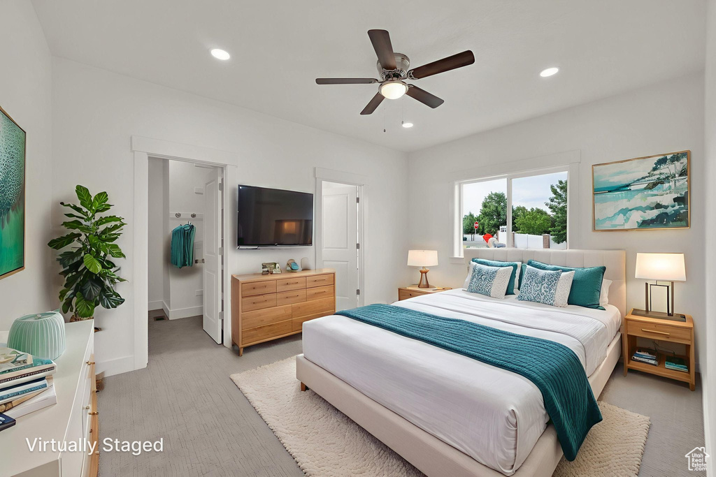 Bedroom with recessed lighting, light colored carpet, and a ceiling fan