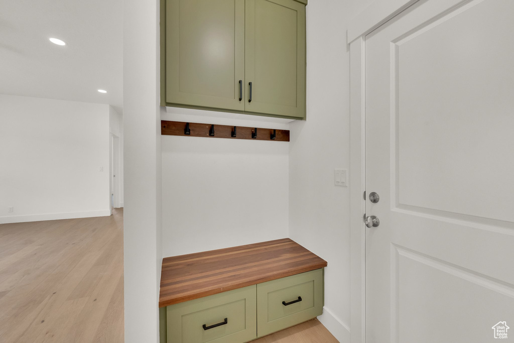 Mudroom with light wood-style flooring and recessed lighting