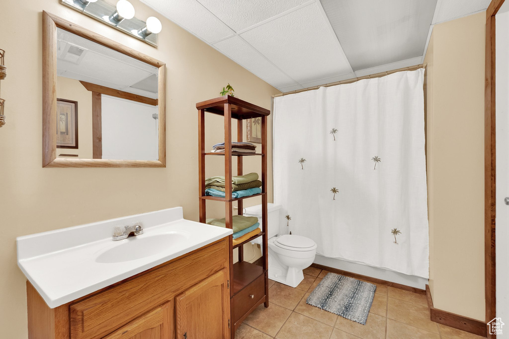 Bathroom featuring vanity, tile patterned flooring, and a shower with curtain