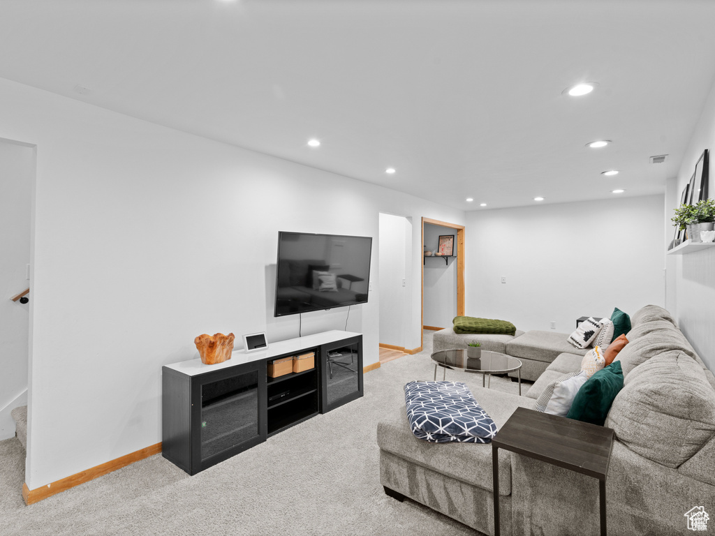 Living room with recessed lighting and carpet floors