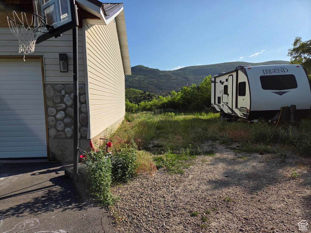 View of property exterior featuring a mountain view