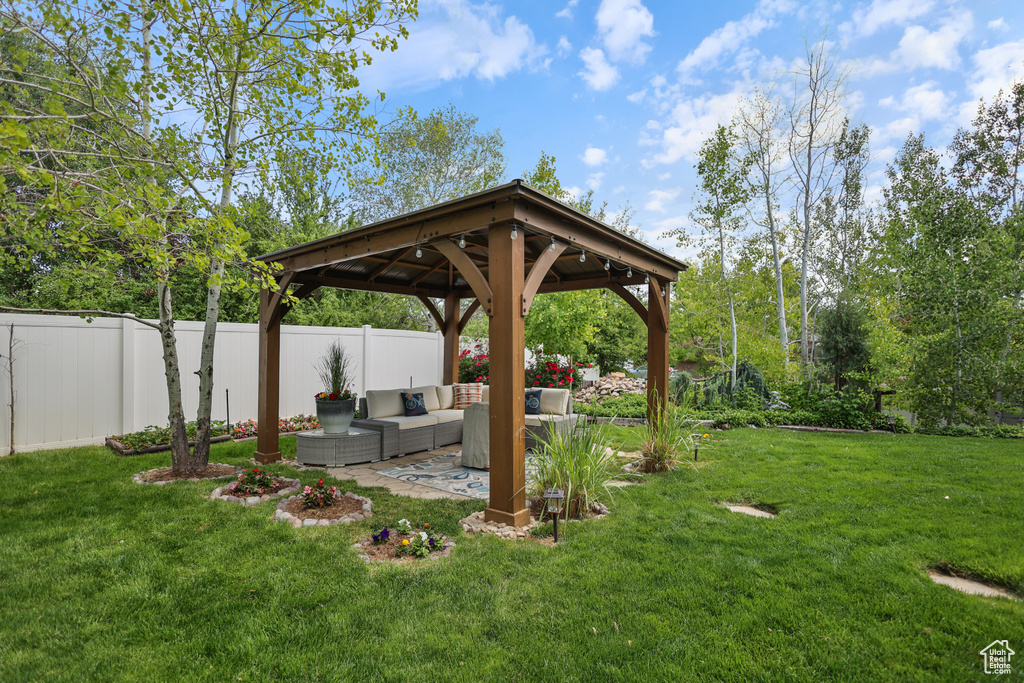 View of yard with a gazebo, outdoor lounge area, and a patio area