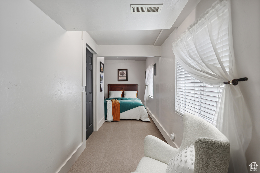Bedroom with carpet flooring and baseboards