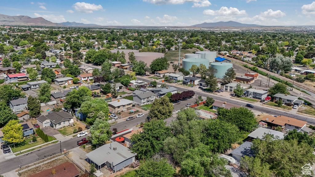 Aerial perspective of suburban area with a mountain backdrop